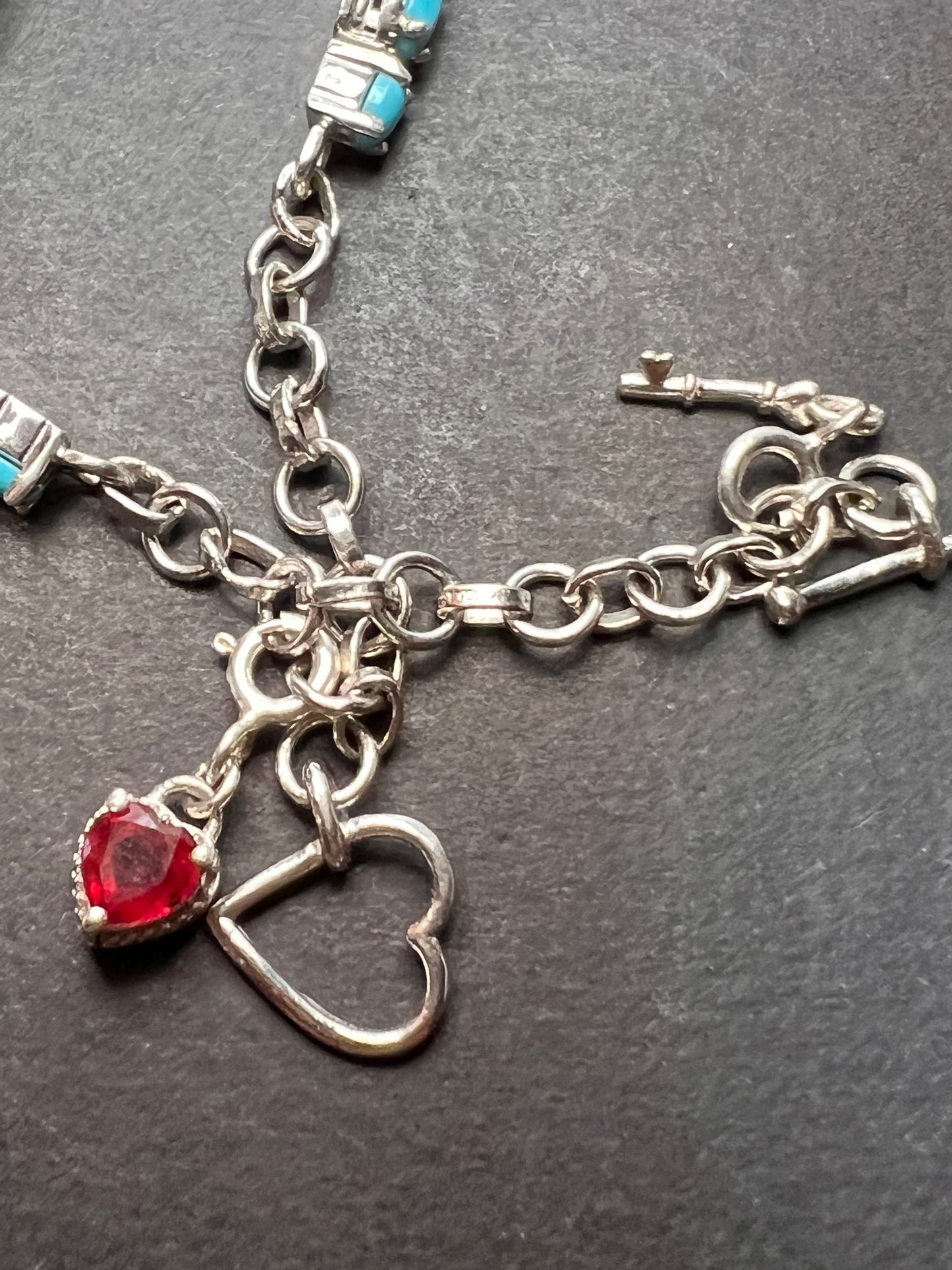 Sleeping Beauty turquoise sterling silver key and heart charm bracelet with toggle clasp and ruby