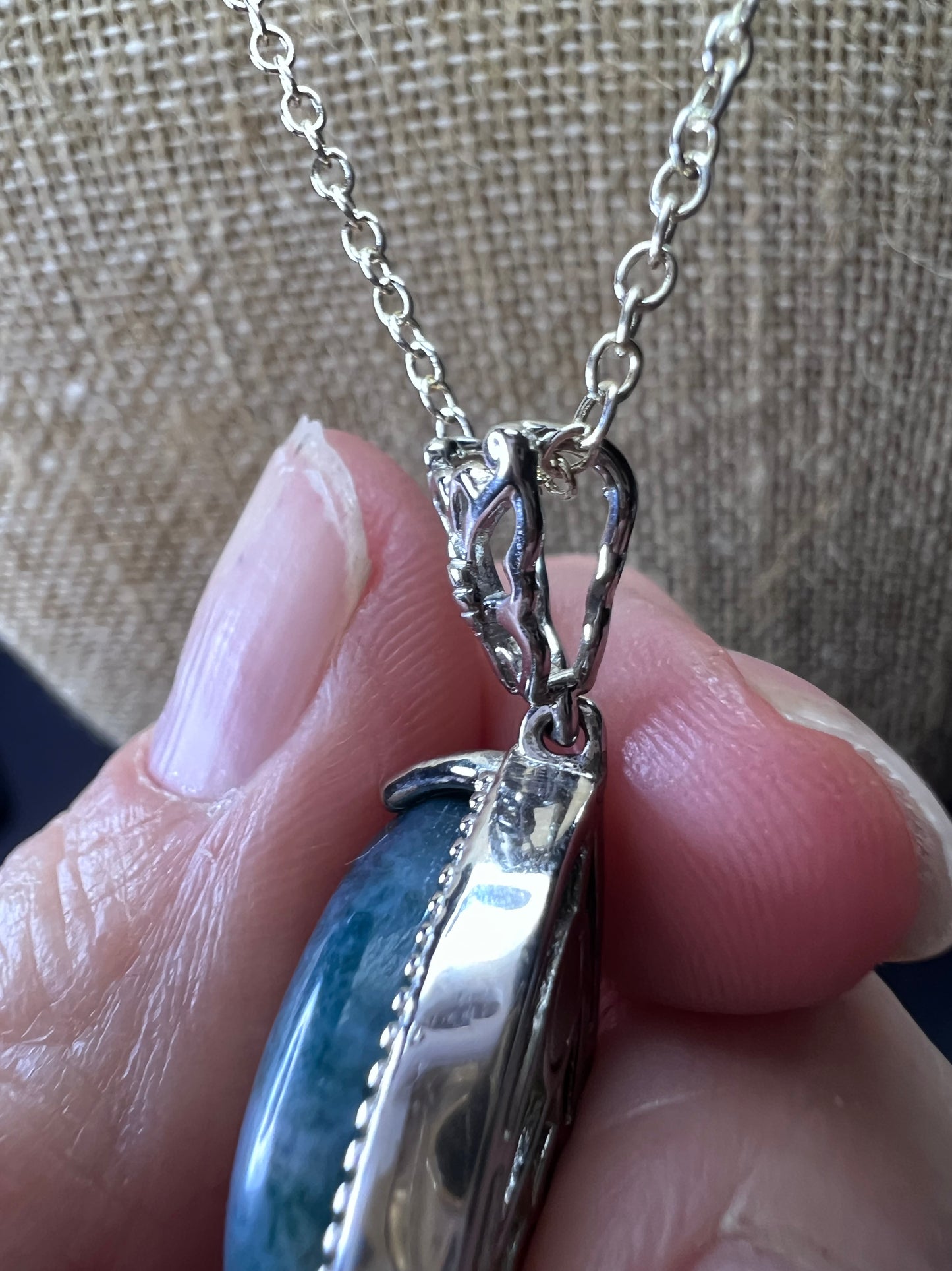 Moss agate teardrop pendant with butterfly in platinum over copper with 18 inch chain