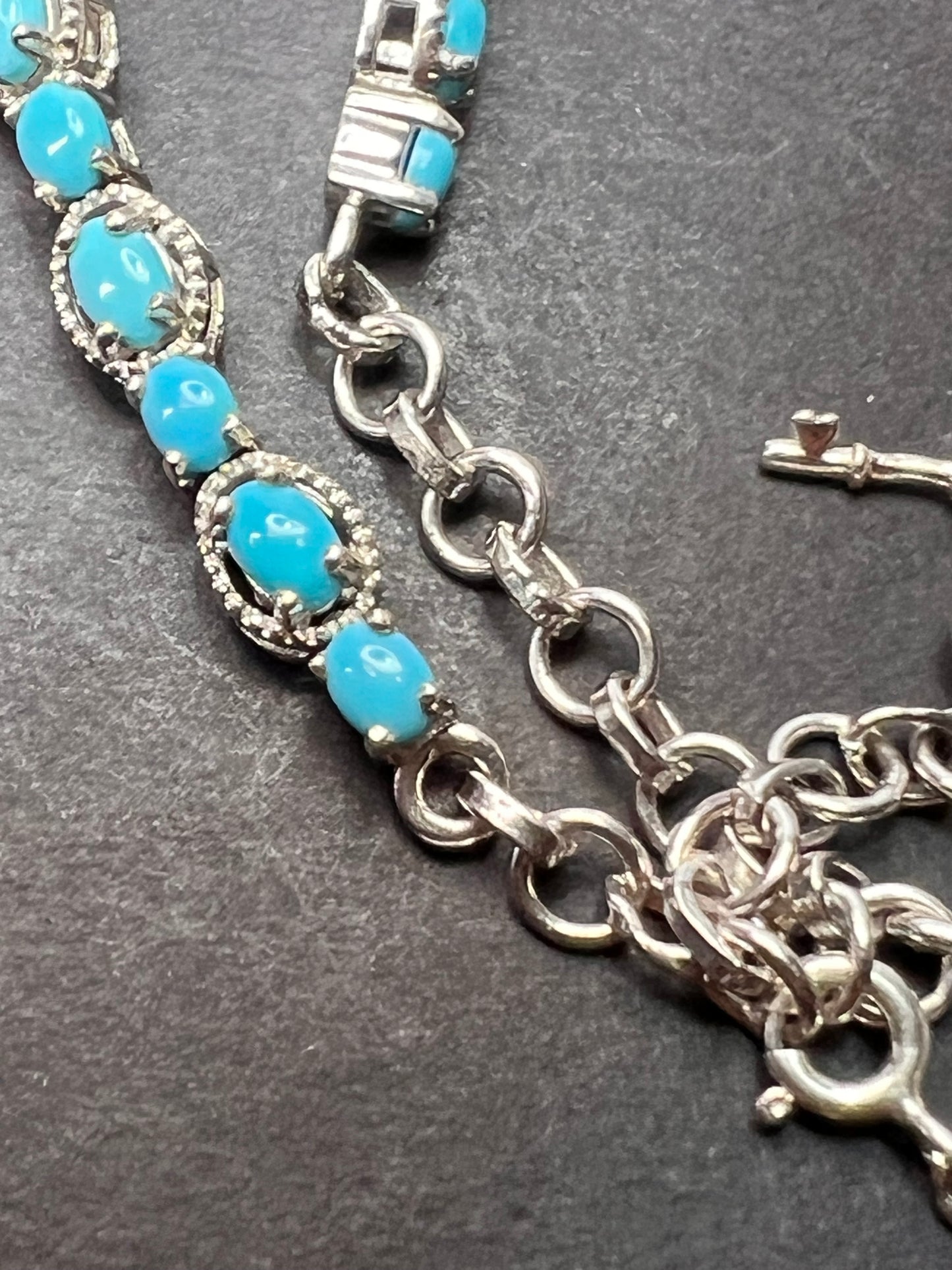 Sleeping Beauty turquoise sterling silver key and heart charm bracelet with toggle clasp and ruby