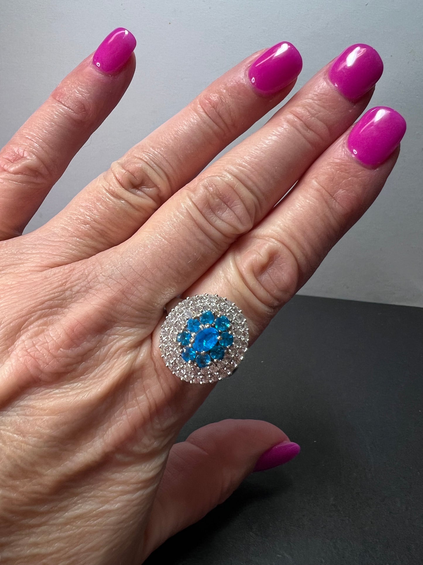 Neon blue apatite and white spinel halo cocktail ring in sterling silver size 9