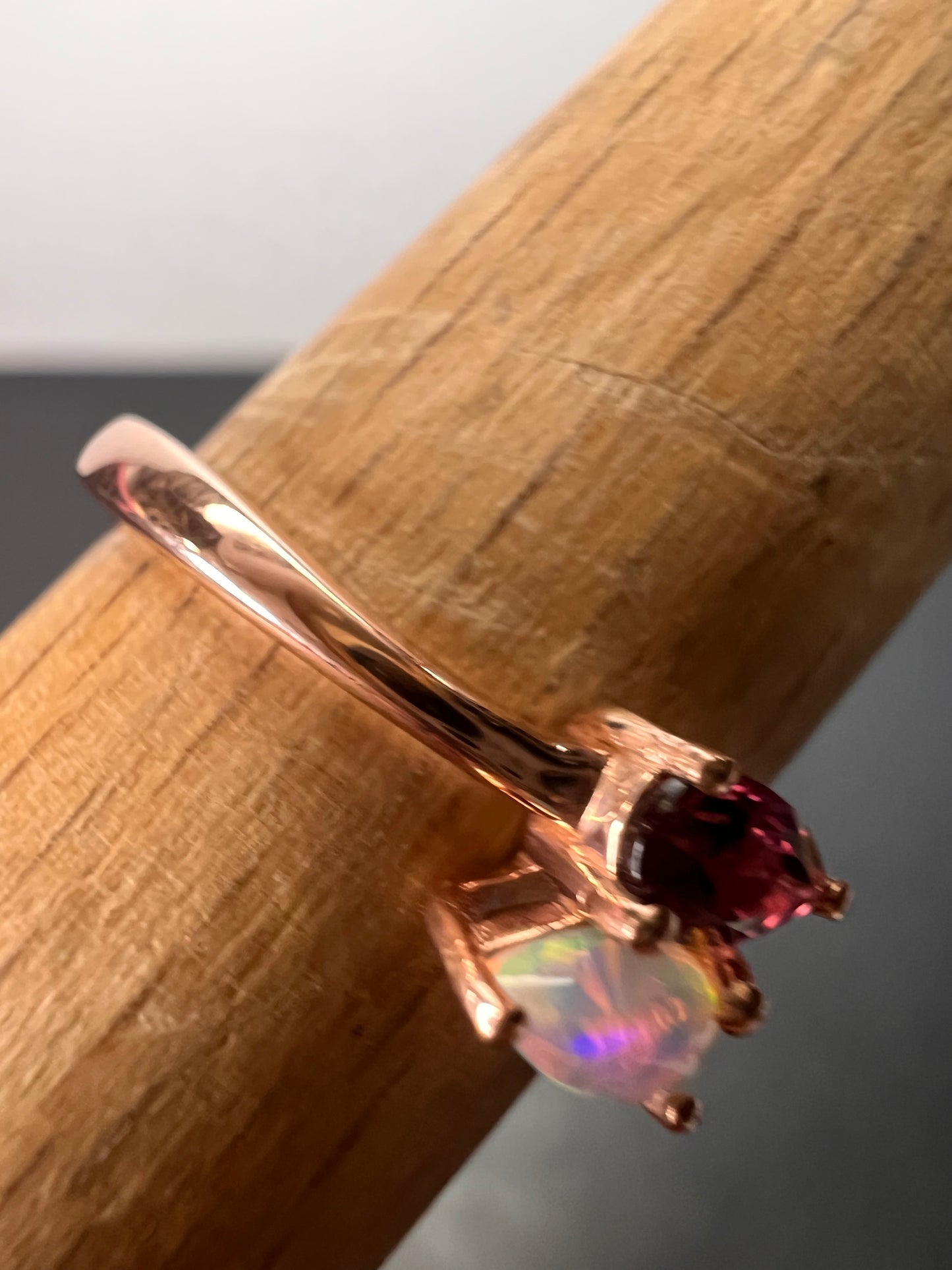 Rubellite and Ethiopian welo opal bypass ring in rose gold vermeil over sterling silver size 7. .35ctw