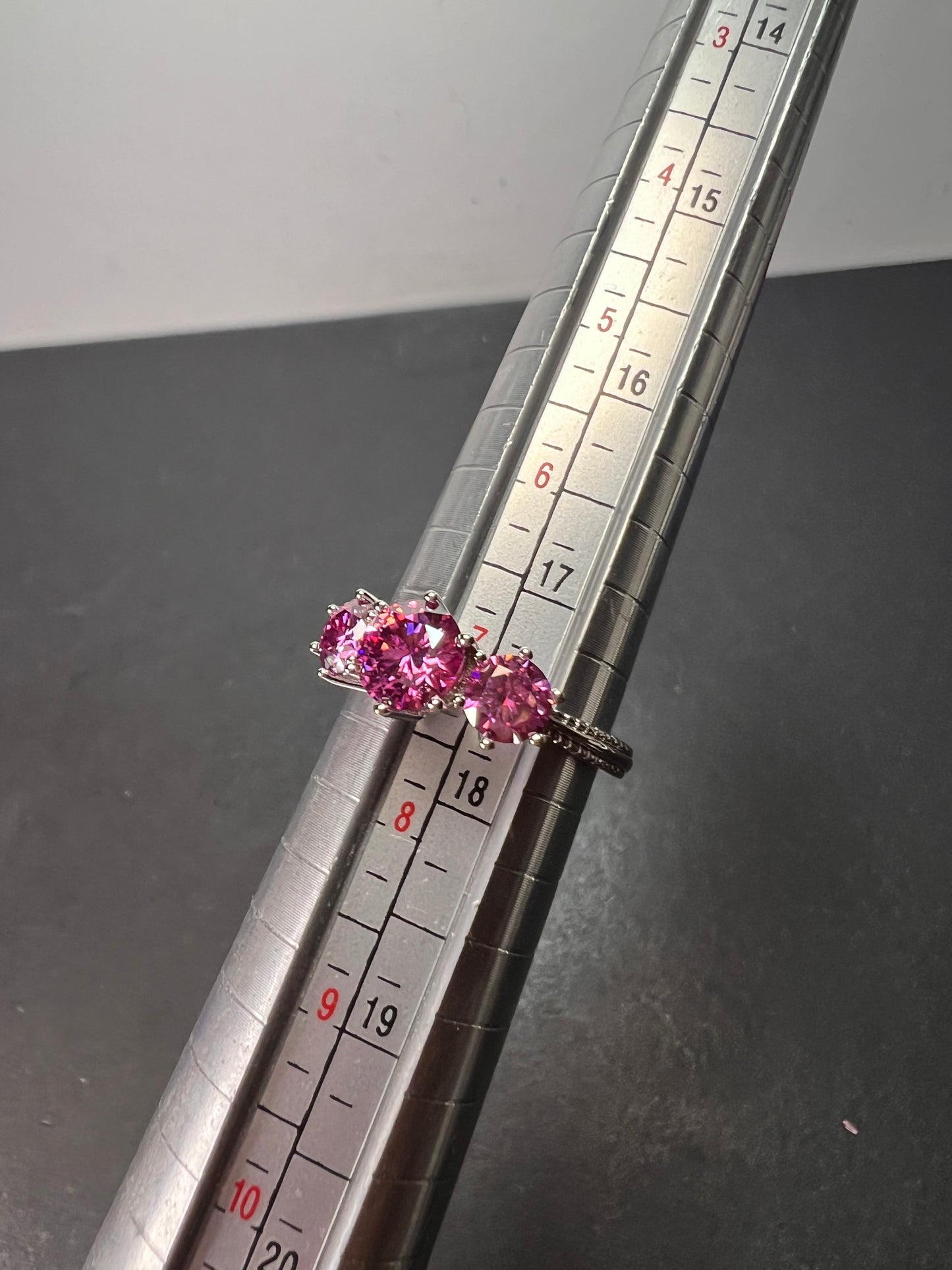 Pink moissanite trilogy ring in platinum over sterling silver size 7