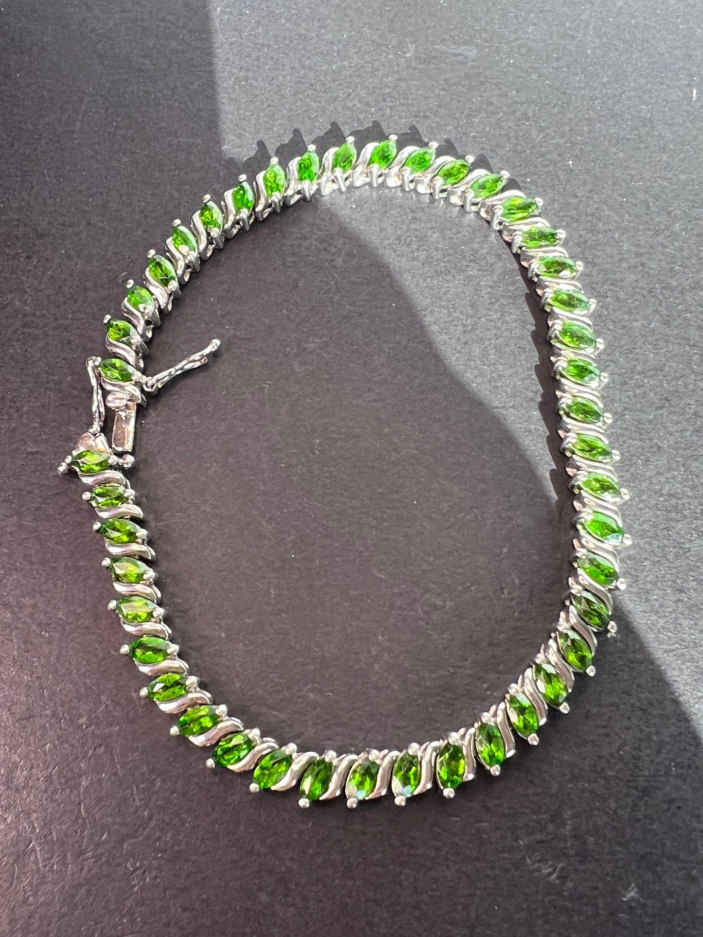 Chrome diopside tennis bracelet in rhodium over sterling silver