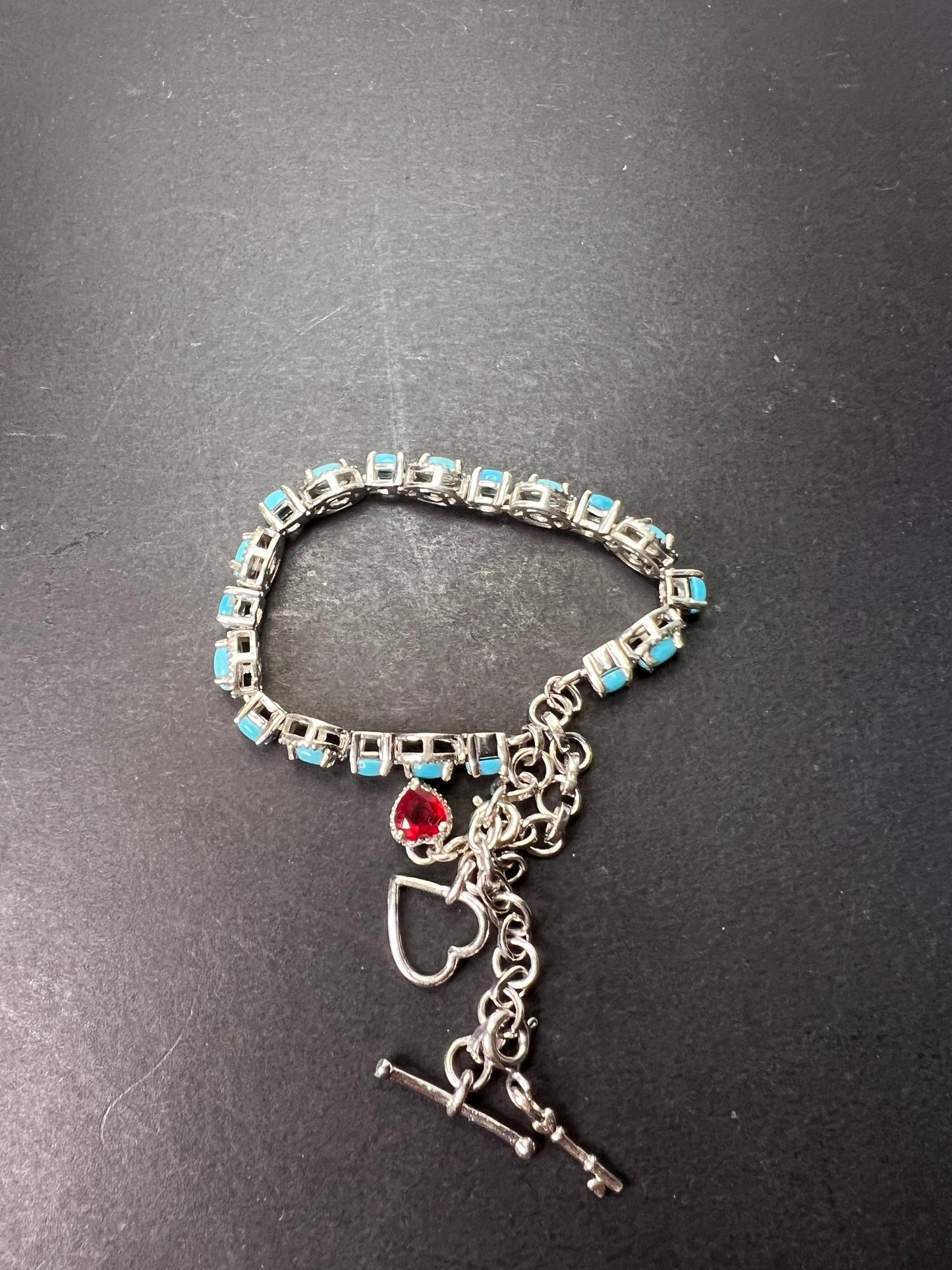 Sleeping Beauty turquoise sterling silver key and heart charm bracelet with toggle clasp and ruby