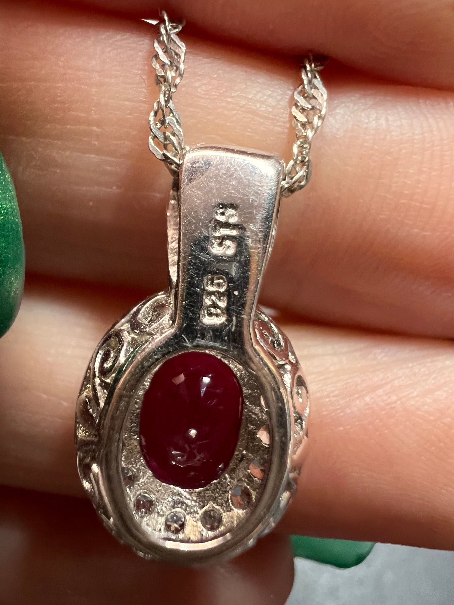 Ruby and zircon two toned halo pendant and chain necklace in sterling silver