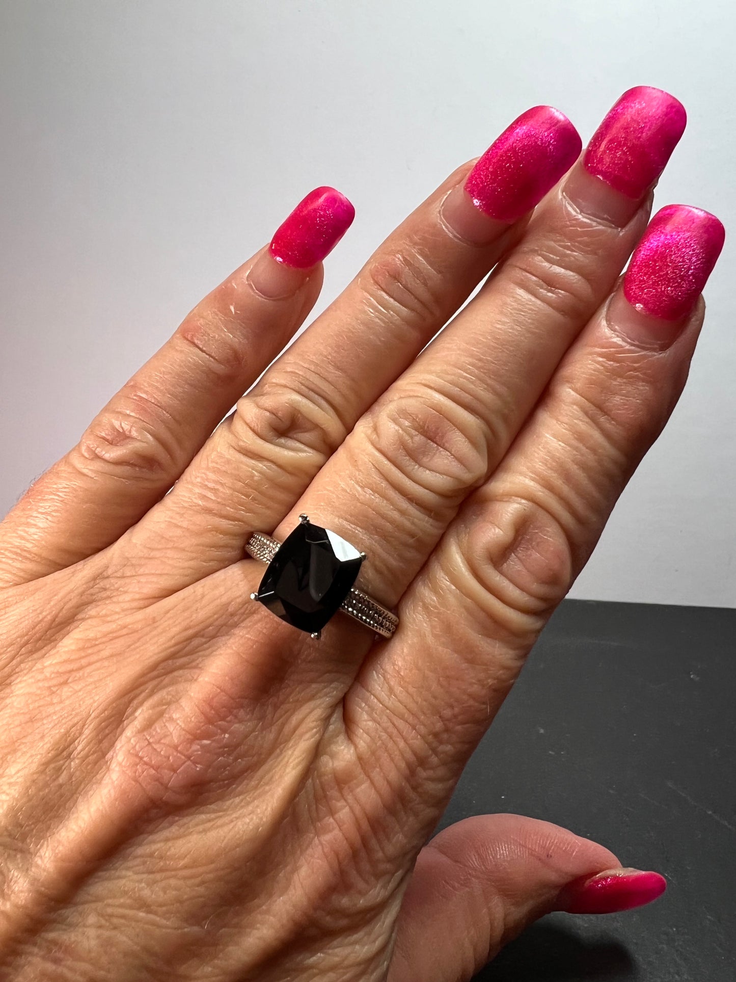 Black spinel in stainless steel ring size 9