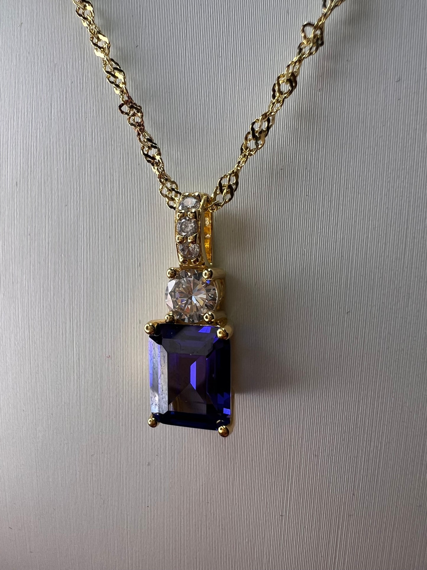 Blue emerald cut CZ pendant and chain necklace in gold over sterling silver 18 inches